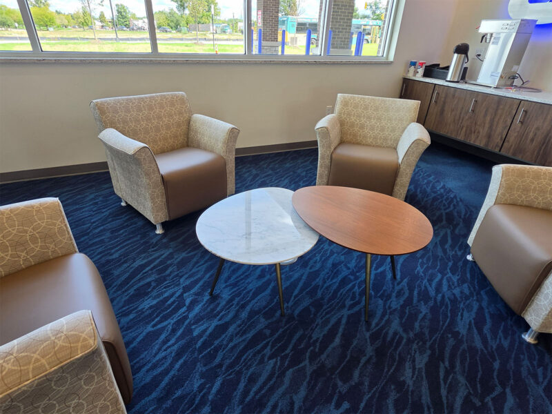 Window-side lounge seating at Dort Financial’s Commerce Township Member Center