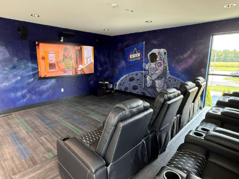 Tiered seating and wall-mounted screen at R1SE in Frankenmuth