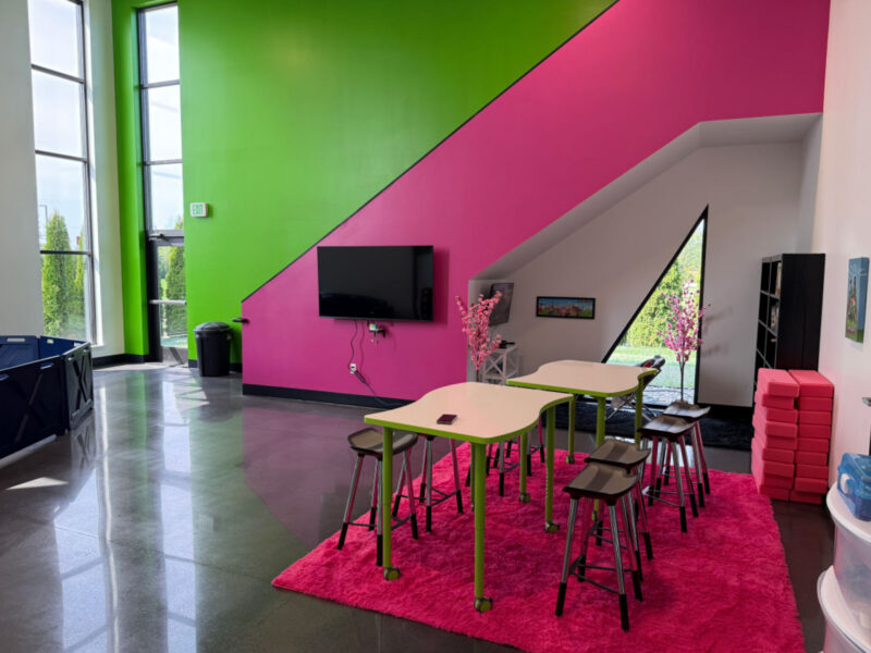Colorful stair wall and activity area at R1SE in Frankenmuth